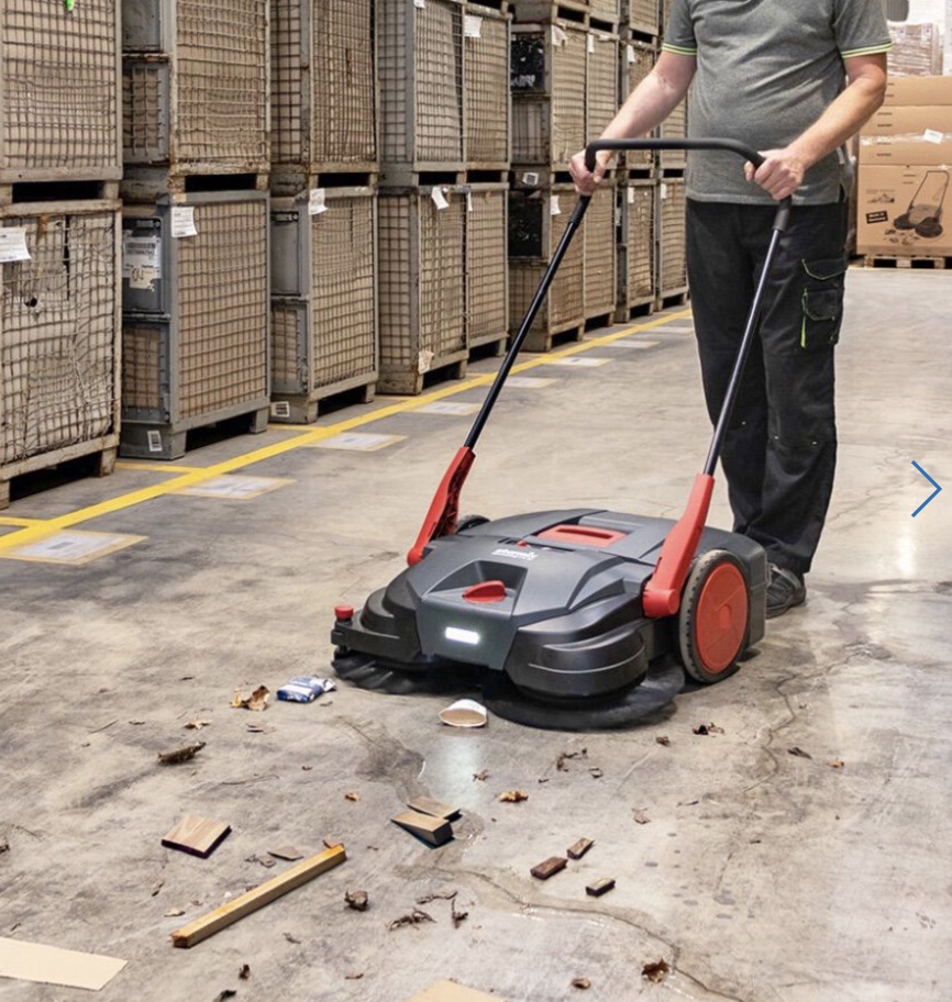 Cleanfix HS770 sweeper being used in a warehouse environment